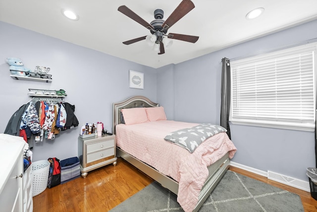 bedroom featuring hardwood / wood-style floors and ceiling fan