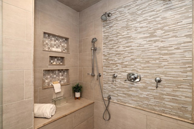 full bathroom with a tile shower