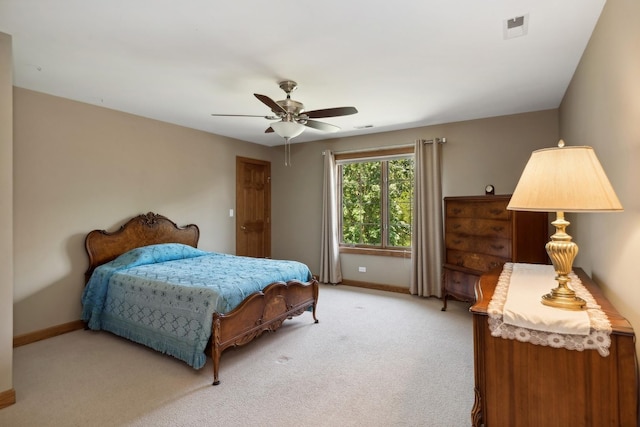 bedroom with light carpet, baseboards, visible vents, and a ceiling fan