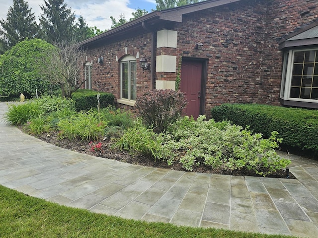 view of side of property with brick siding