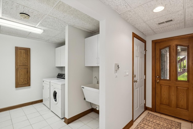 laundry room with separate washer and dryer, a sink, visible vents, baseboards, and cabinet space