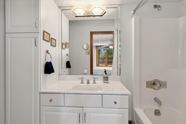 bathroom featuring bathtub / shower combination and vanity