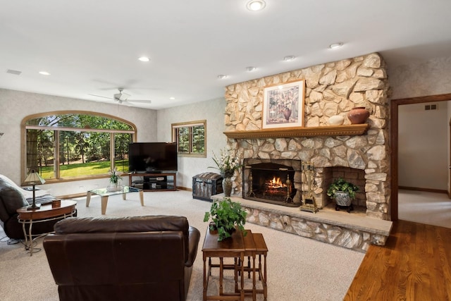 living room featuring a fireplace, visible vents, a ceiling fan, and recessed lighting