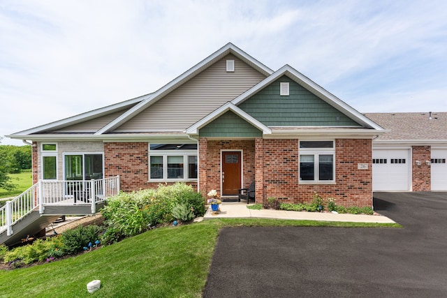 view of front facade with a front lawn and a garage