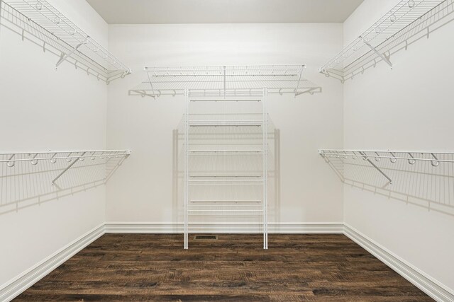 spacious closet featuring hardwood / wood-style floors