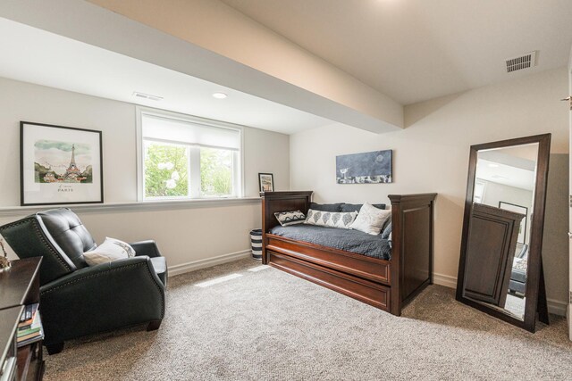 bedroom featuring light carpet