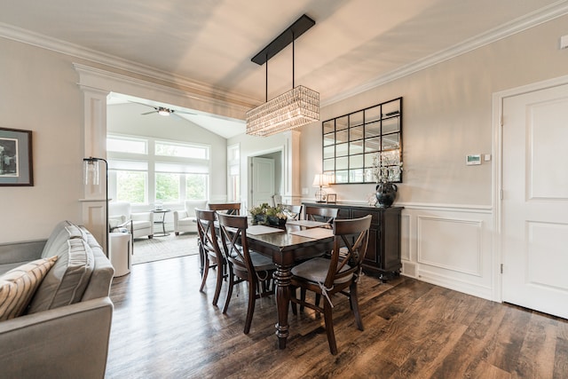 dining space featuring lofted ceiling, wood-type flooring, crown molding, and ceiling fan