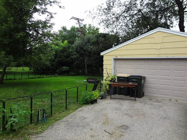 garage featuring a lawn