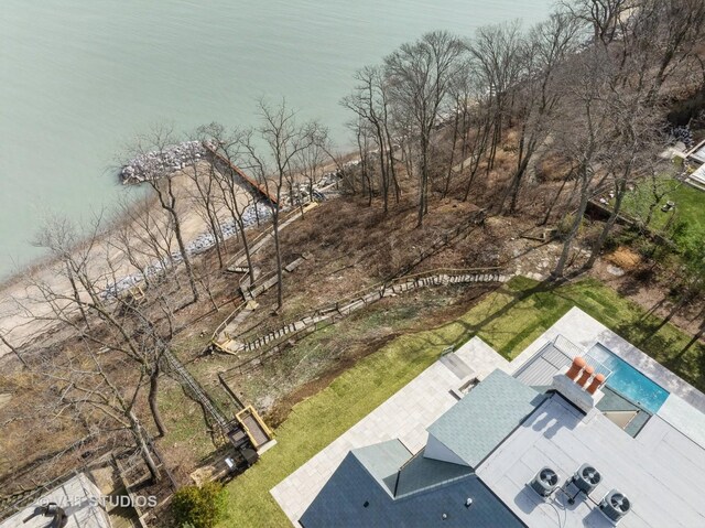 birds eye view of property with a water view