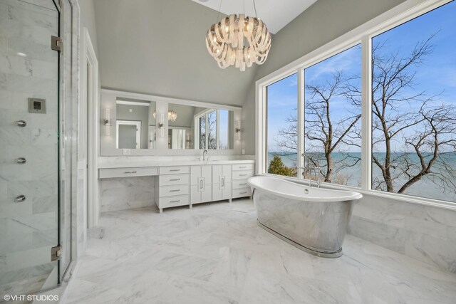 bathroom with shower with separate bathtub, vanity, a chandelier, and tile patterned flooring