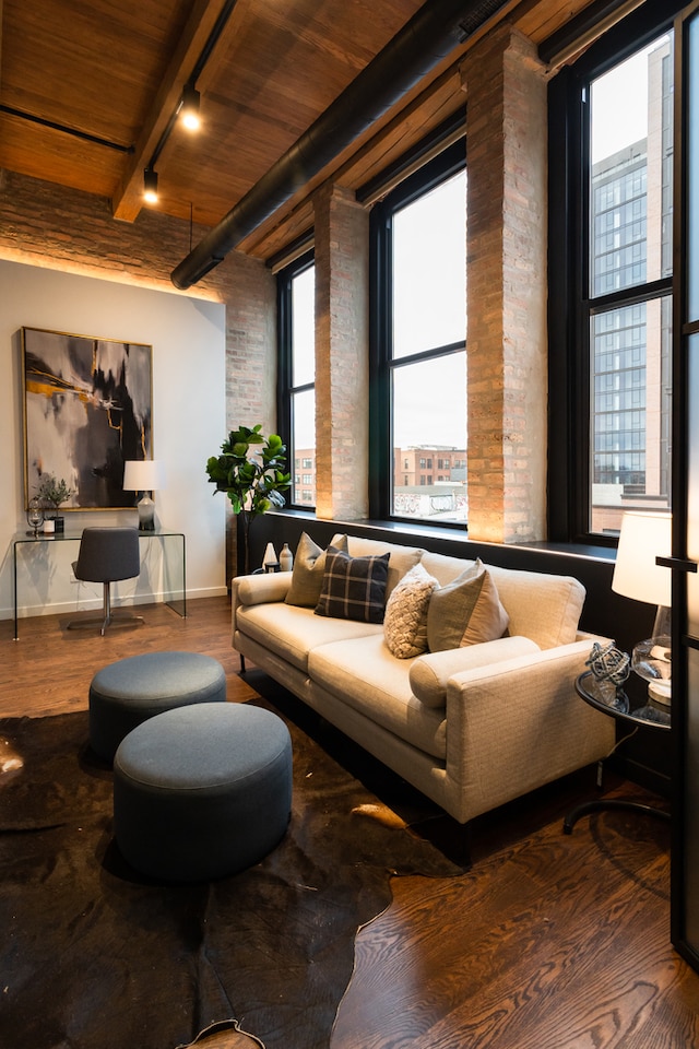 living room featuring wood ceiling, plenty of natural light, and hardwood / wood-style floors