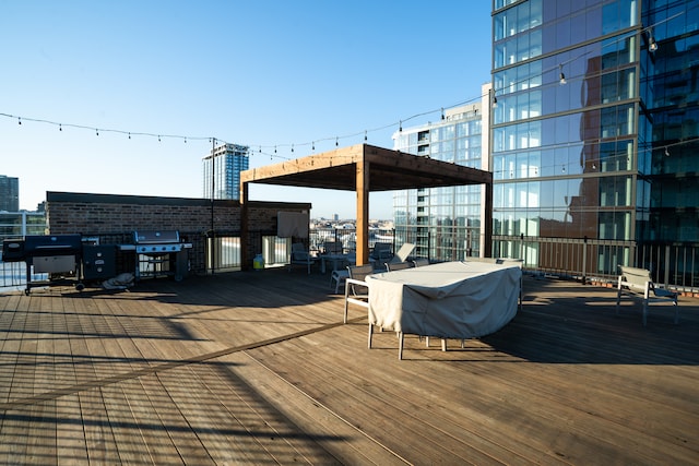 wooden deck featuring grilling area