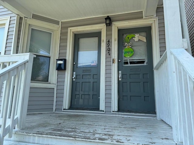 doorway to property featuring covered porch