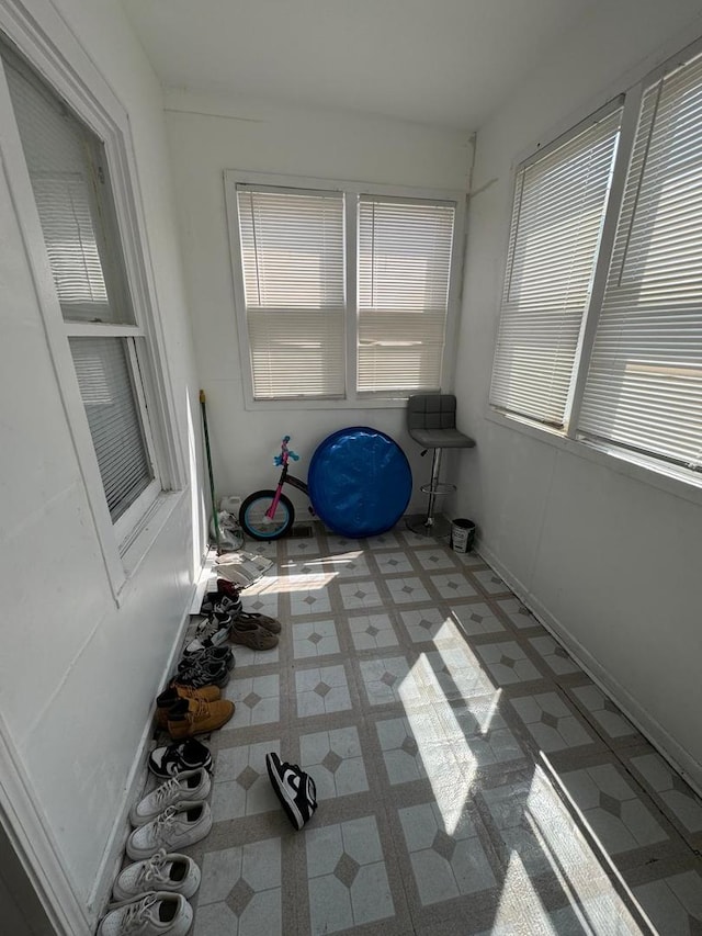 unfurnished sunroom featuring a healthy amount of sunlight