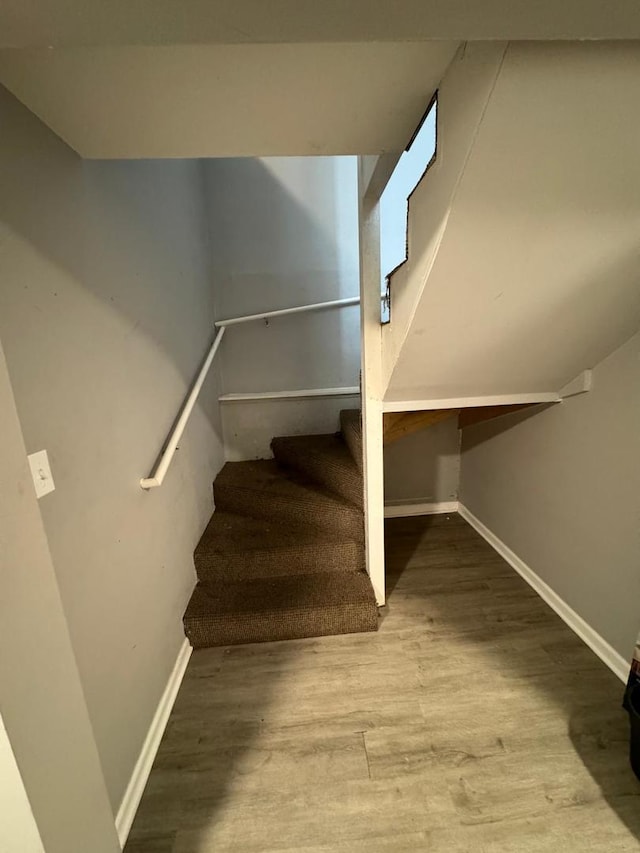 stairs with wood-type flooring