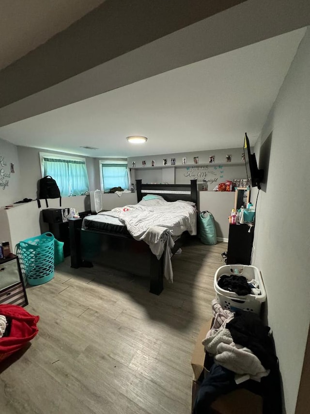 bedroom with light wood-type flooring