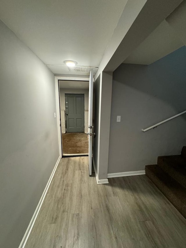 hallway with wood-type flooring