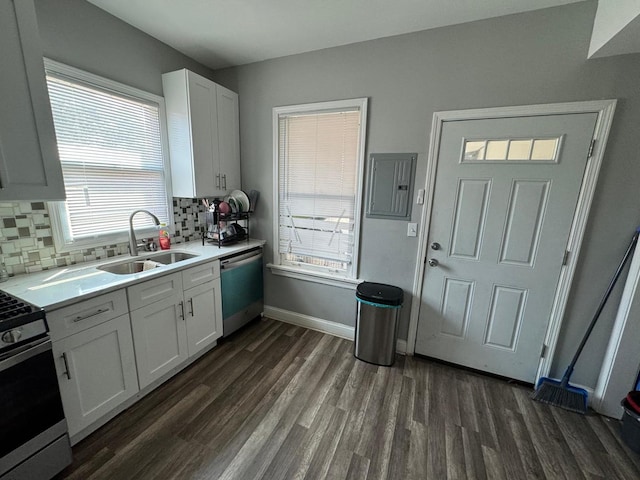 kitchen featuring white cabinets, stainless steel appliances, sink, and tasteful backsplash