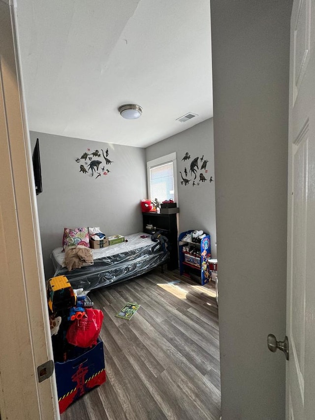 bedroom featuring hardwood / wood-style flooring