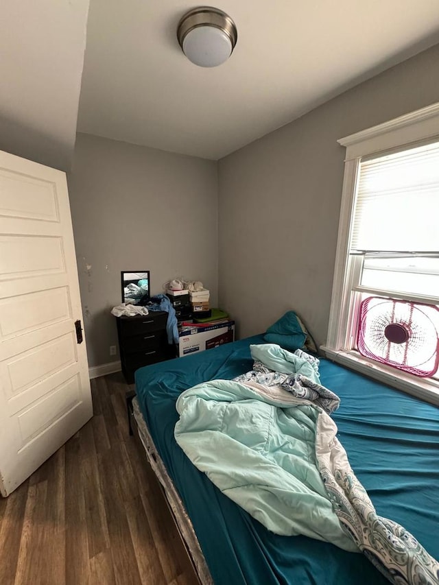 bedroom featuring dark hardwood / wood-style floors