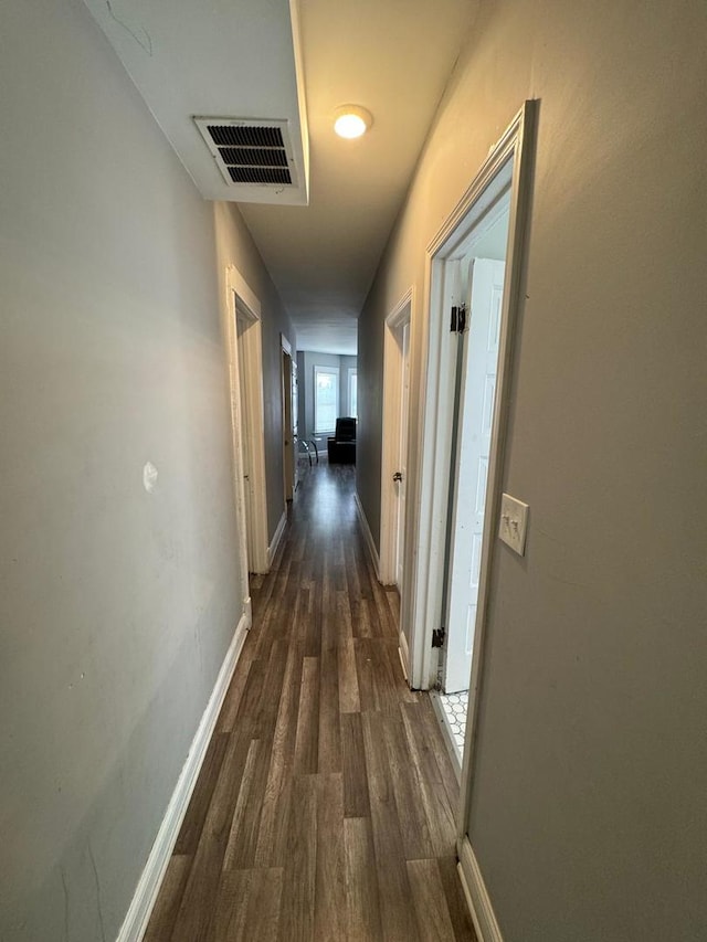 hallway featuring dark hardwood / wood-style floors