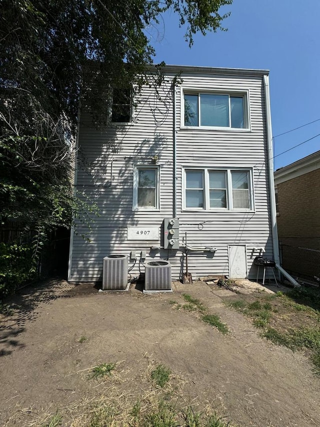 back of house with cooling unit