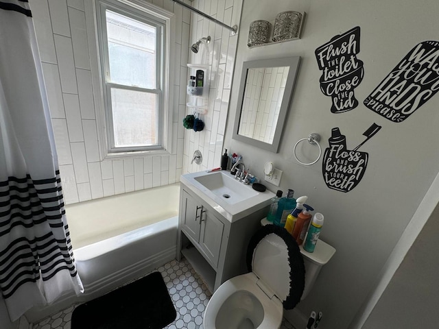 full bathroom with toilet, plenty of natural light, shower / bath combo with shower curtain, and vanity