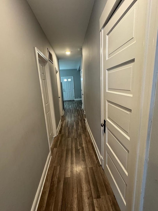 hallway featuring dark wood-type flooring