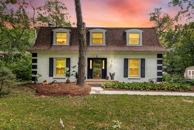 view of front of house with a lawn