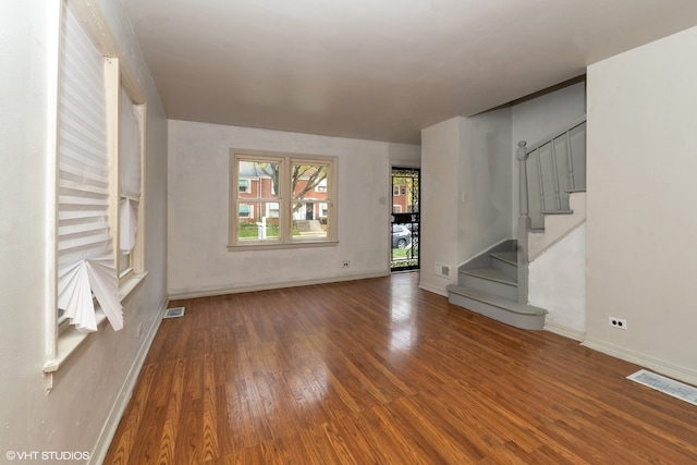 unfurnished living room featuring wood-type flooring