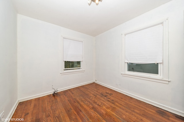 empty room featuring dark hardwood / wood-style floors