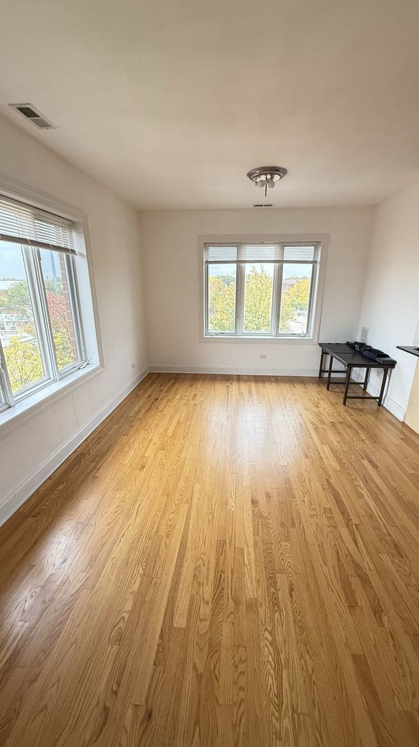 unfurnished room featuring light hardwood / wood-style floors