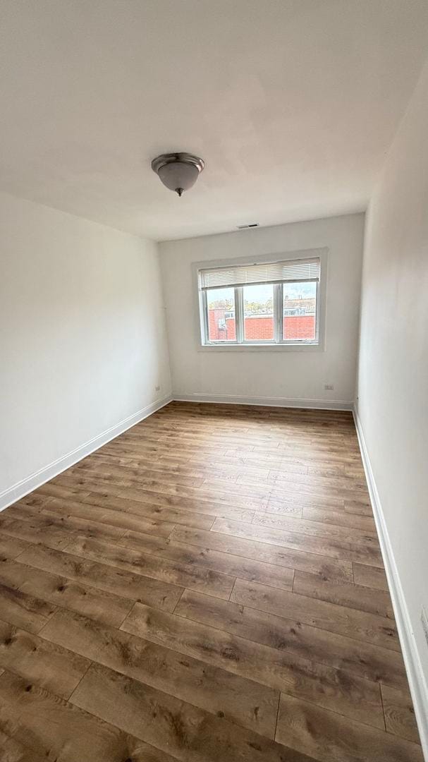 unfurnished room featuring dark hardwood / wood-style floors