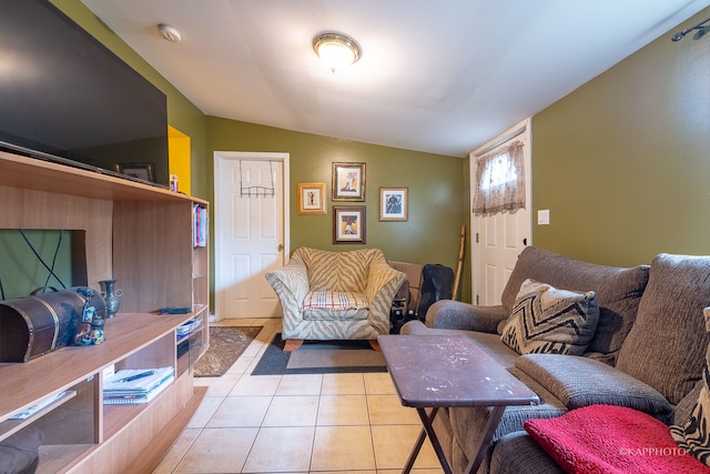 tiled living room with lofted ceiling