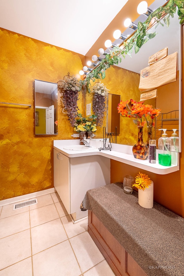 bathroom with tile patterned flooring and vanity