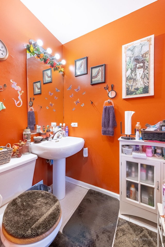 bathroom featuring toilet and tile patterned floors