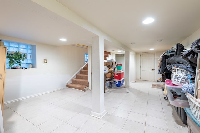 basement featuring light tile patterned floors