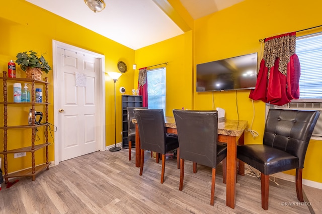 dining area with hardwood / wood-style flooring