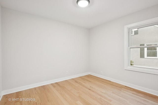 empty room featuring hardwood / wood-style flooring