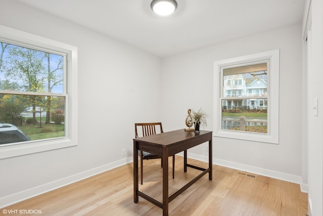 office space with light hardwood / wood-style floors