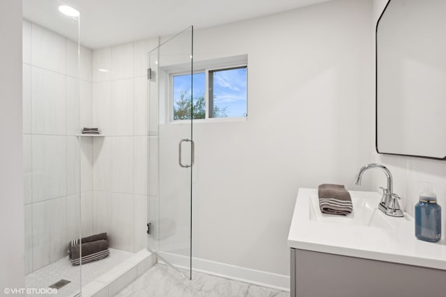 bathroom featuring vanity and a shower with shower door