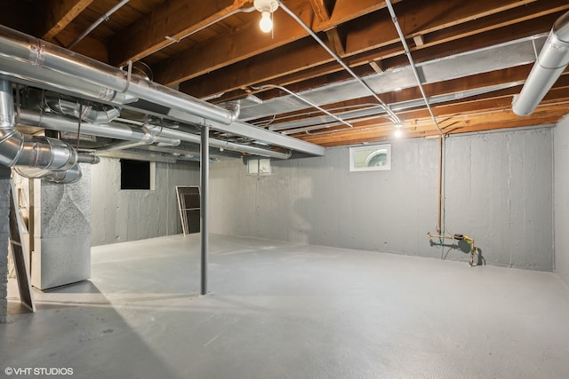 basement featuring heating unit