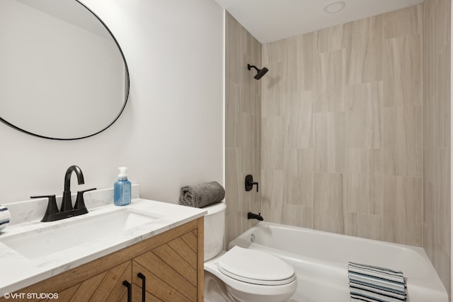 full bathroom featuring vanity, toilet, and tiled shower / bath combo