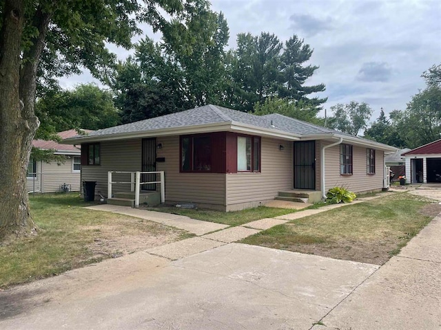 single story home with a front lawn and a garage