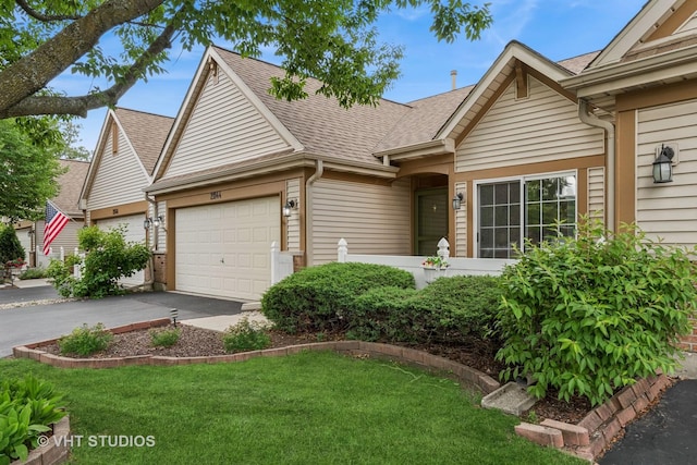 21144 W Buckeye Ct, Plainfield, IL 60544 - view of front facade with roof with shingles, asphalt driveway, a garage, and a front yard