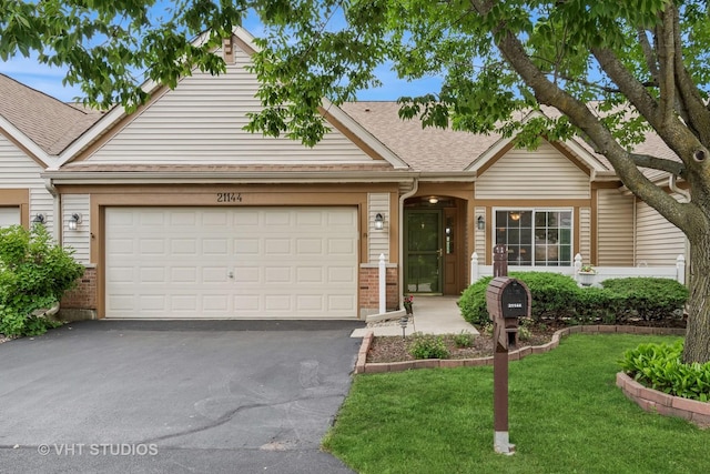 21144 W Buckeye Ct, Plainfield, IL 60544 - view of front of house featuring brick siding, asphalt driveway, an attached garage, and a front yard
