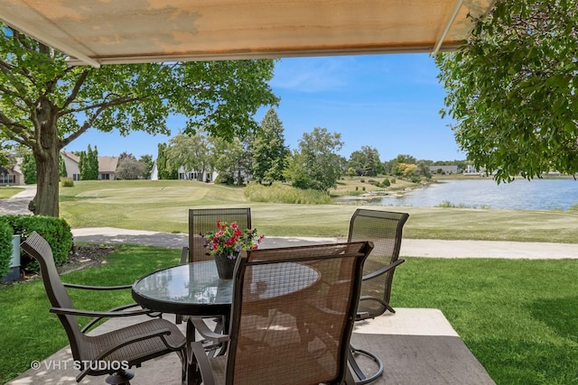 21144 W Buckeye Ct, Plainfield, IL 60544 - view of patio featuring a water view, outdoor dining space, and view of golf course