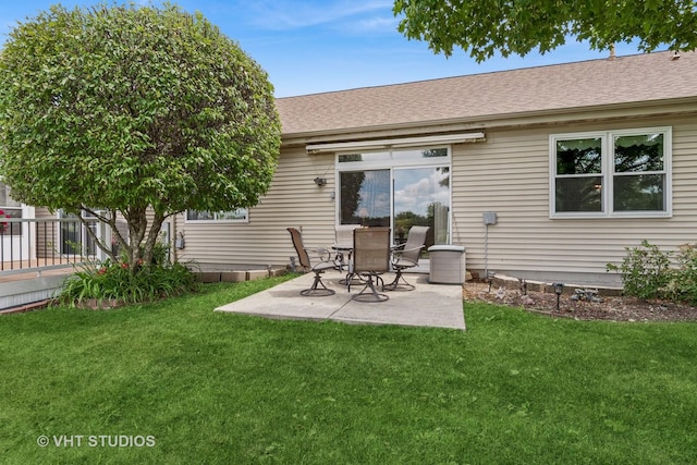 21144 W Buckeye Ct, Plainfield, IL 60544 - rear view of property with a patio area, a lawn, and a shingled roof