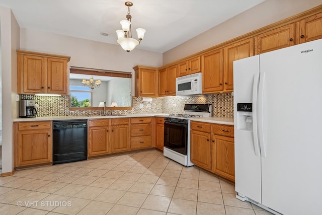 21144 W Buckeye Ct, Plainfield, IL 60544 - kitchen with white appliances, a chandelier, light countertops, tasteful backsplash, and light tile patterned floors