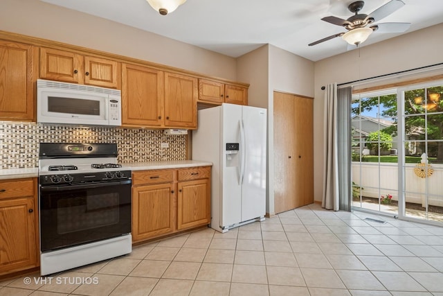 21144 W Buckeye Ct, Plainfield, IL 60544 - kitchen with white appliances, light countertops, tasteful backsplash, and ceiling fan